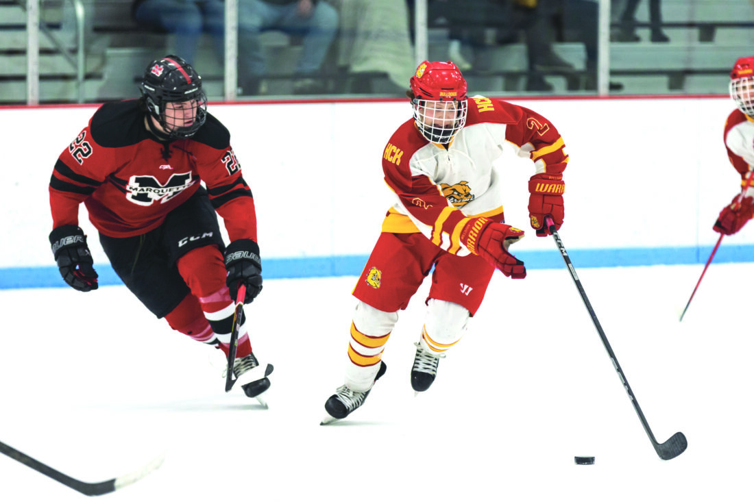 Jump all over it Marquette Senior High School hockey team scores